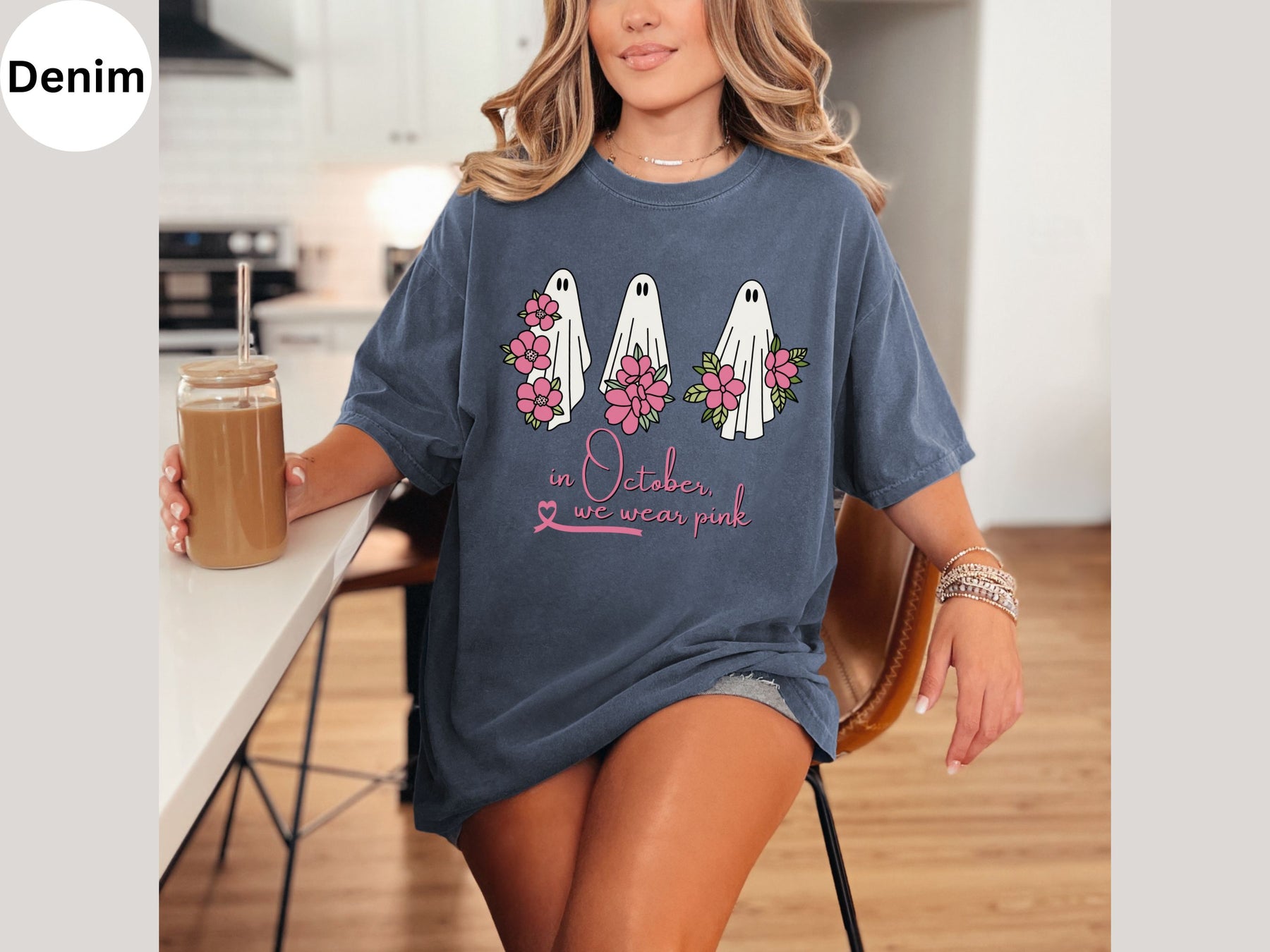 a woman sitting on a chair holding a drink