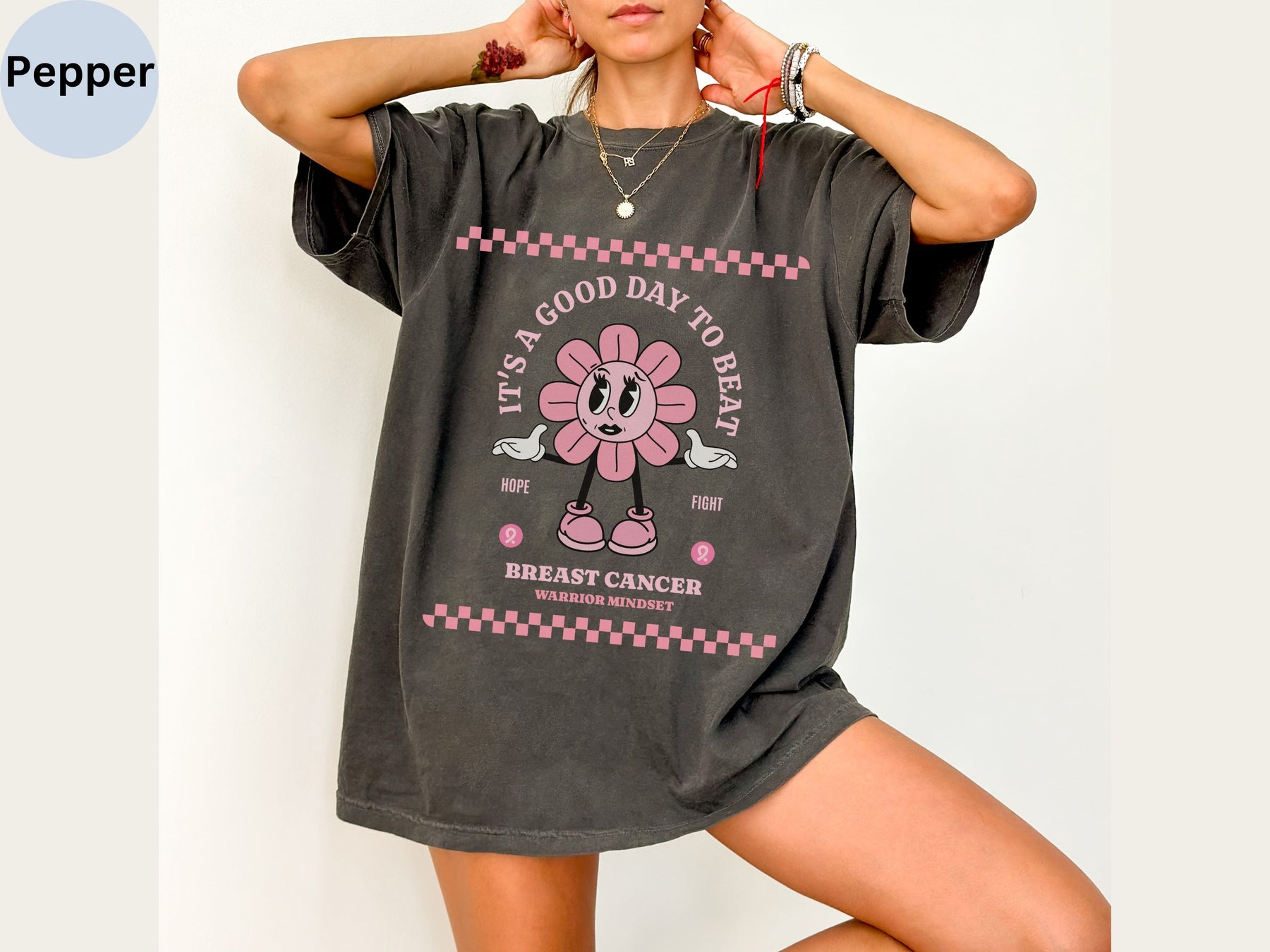 a woman posing for a picture wearing a mickey mouse shirt