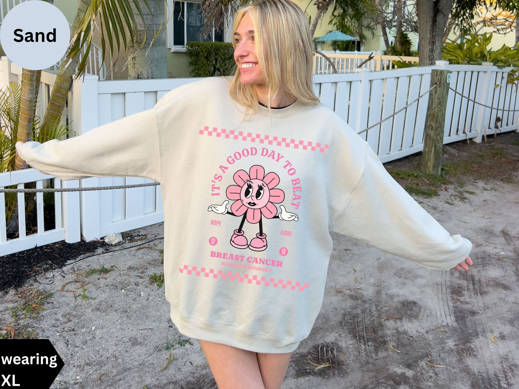 a woman wearing a sweatshirt with a cartoon character on it