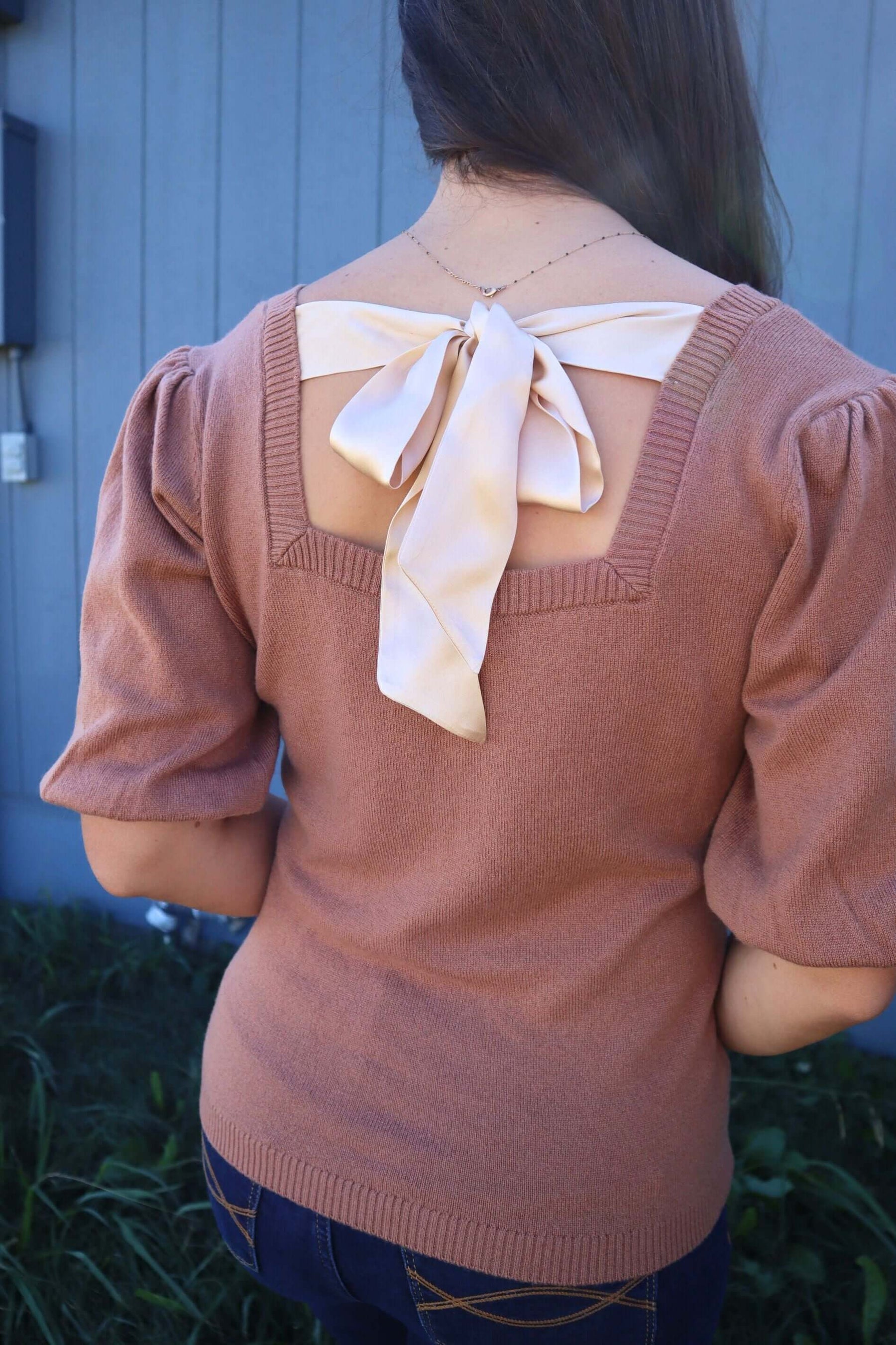 Woman wearing Brown Cashmere Sweater with Silk Bow and Short Sleeves