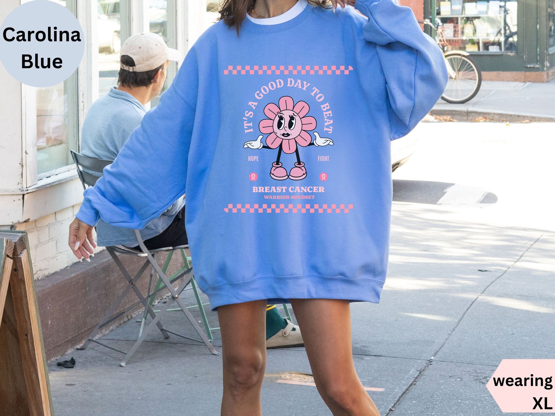 a woman wearing a blue sweatshirt and matching heels