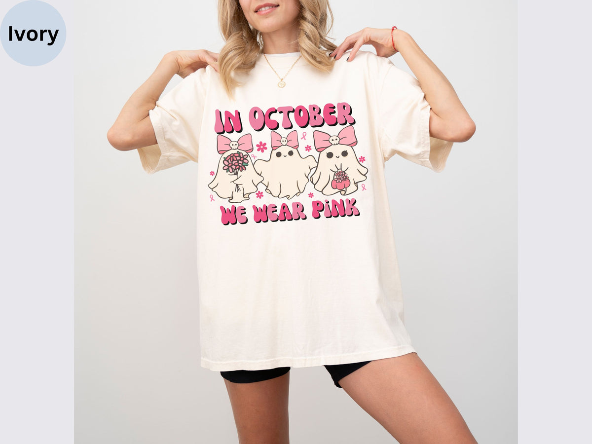 a woman wearing a t - shirt that says an october we wear pink