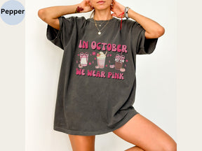 a woman posing in a t - shirt that says in october we wear pink