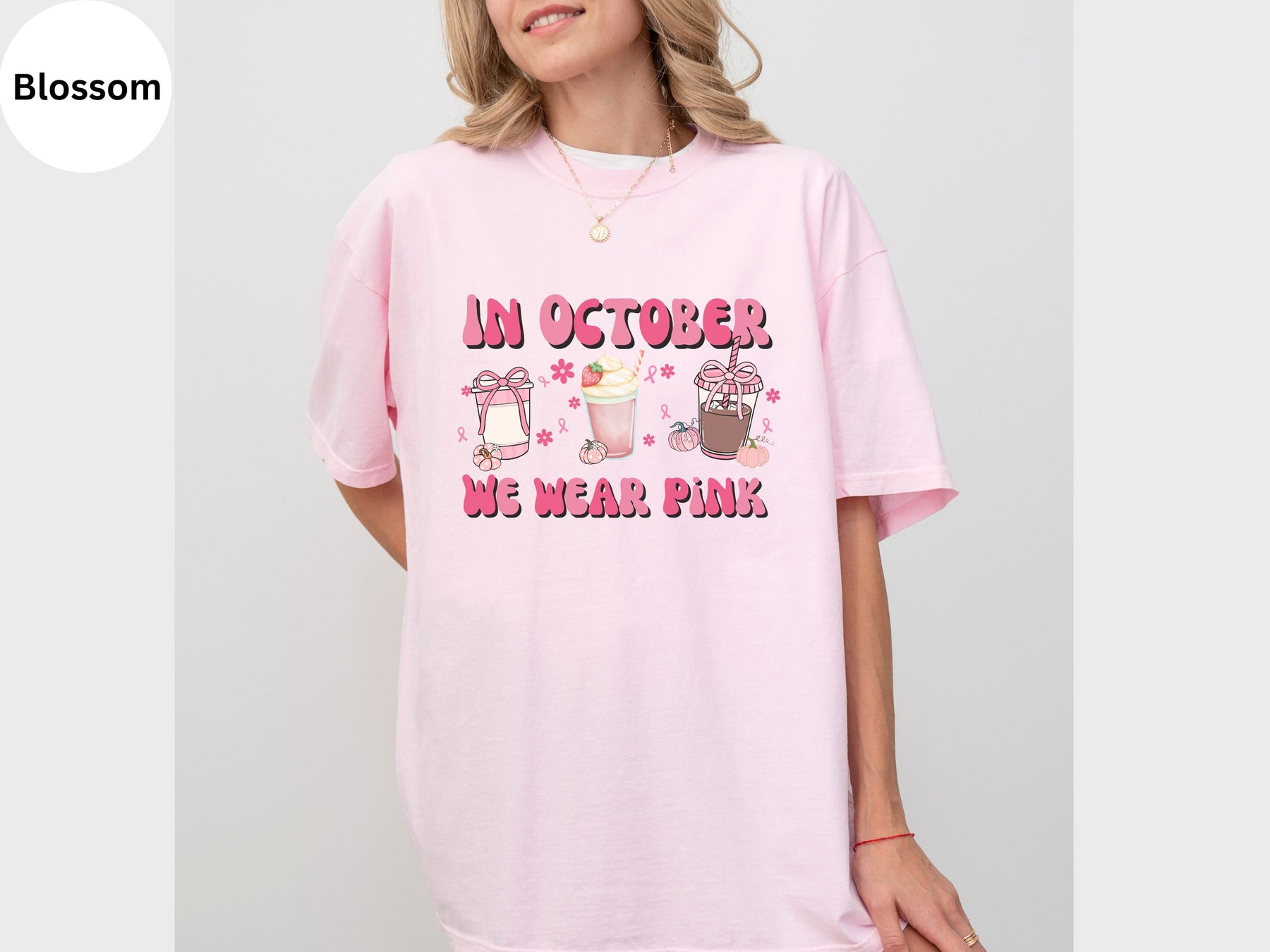 a woman wearing a pink shirt that says in october we wear pink