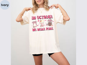 a woman wearing a t - shirt that says i'm october we wear pink