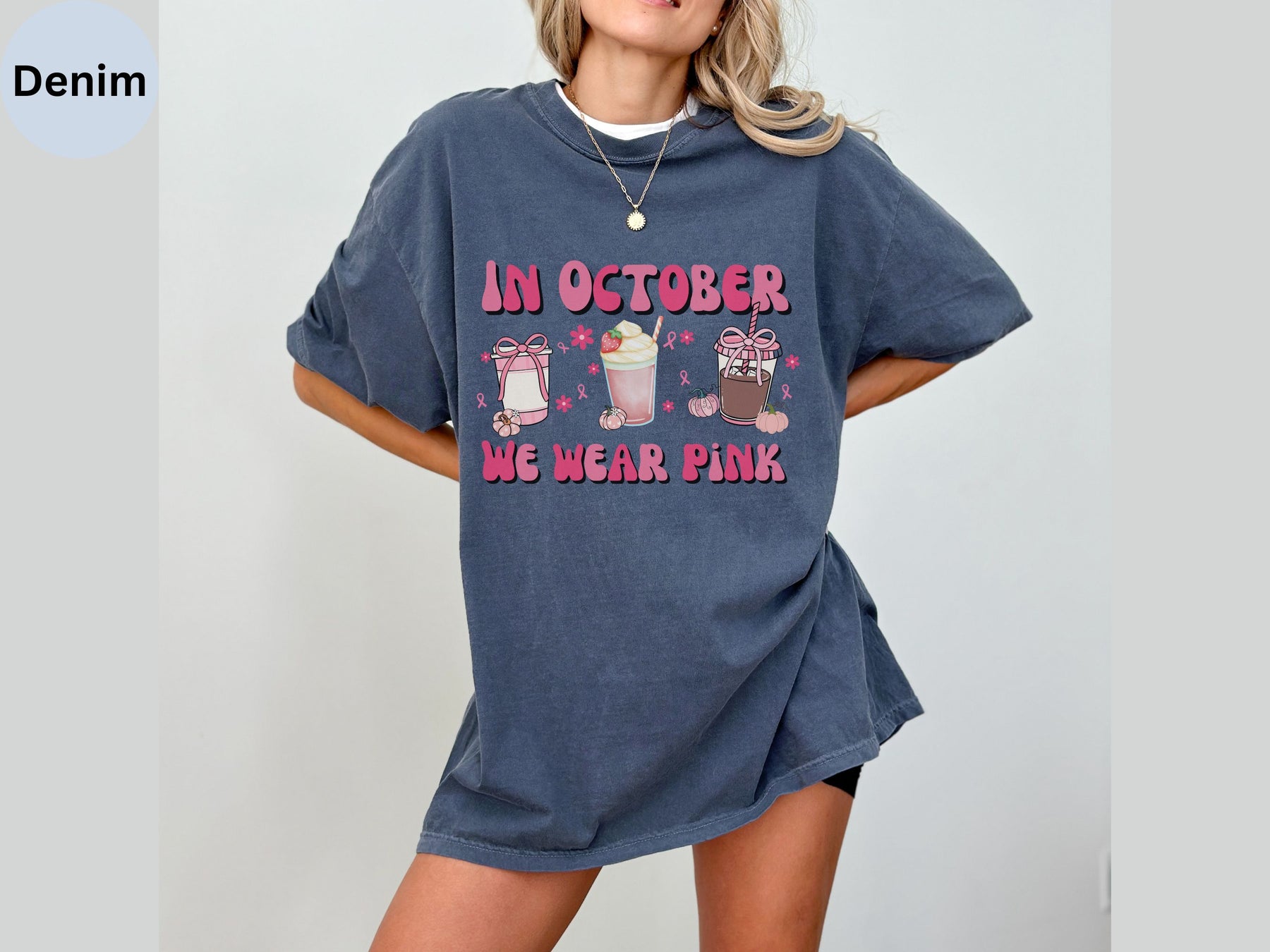 a woman wearing a t - shirt that says in october we wear pink