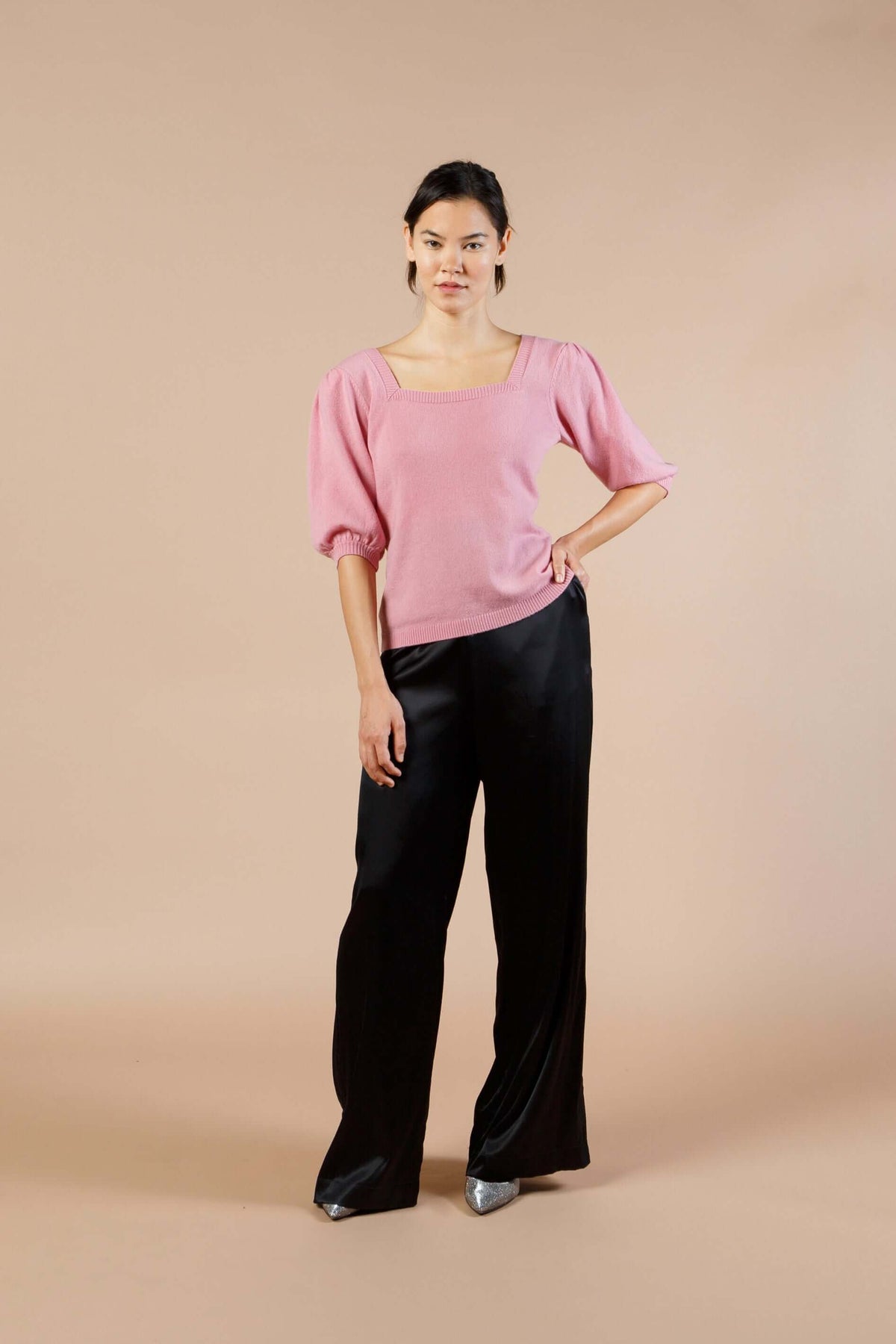 Woman wearing Pink Cashmere Sweater with Silk Bow and Short Sleeves