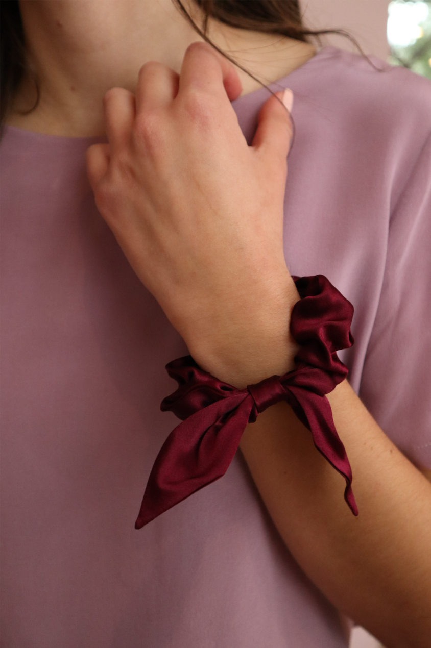 Woman wearing sustainable Red Silk Scrunchie with Bow