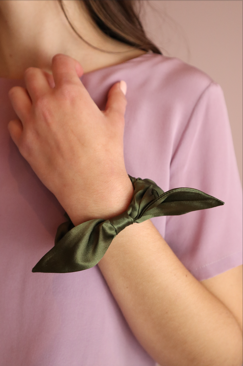 Woman wearing sustainable Green Silk Scrunchie with Bow