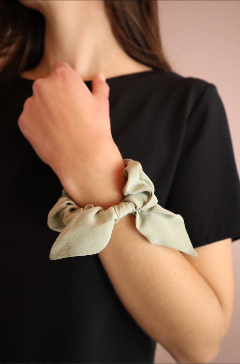 Woman wearing sustainable Red Silk Scrunchie with Bow