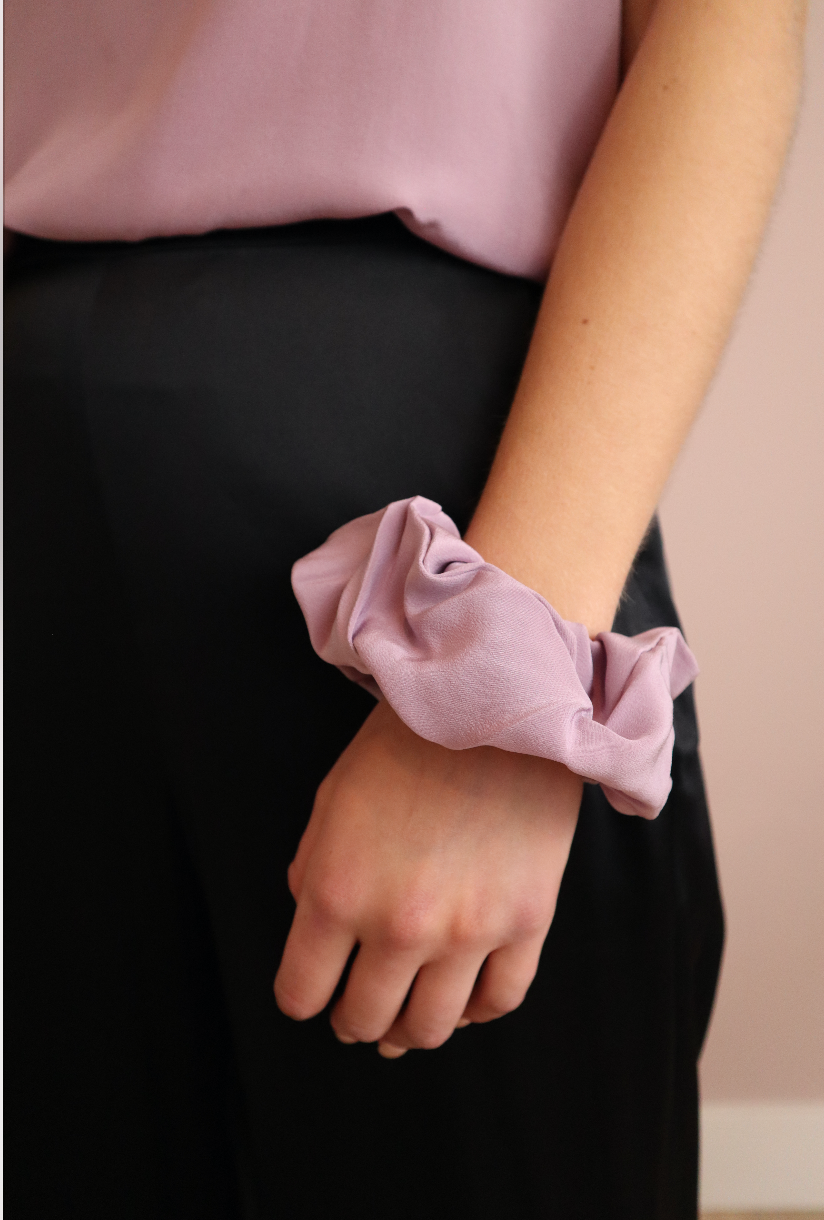 woman wearing sustainable lilac silk scrunchies wrist