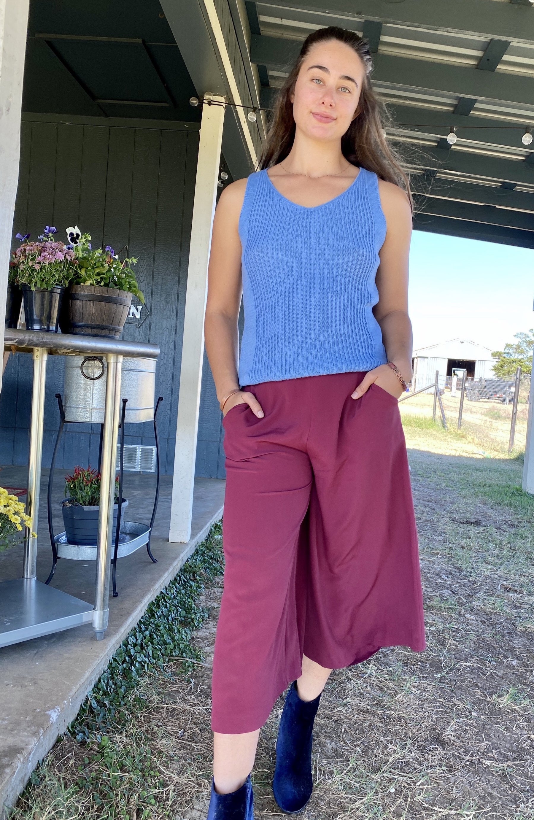 Woman Wearing sustainable red silk culottes ankle pants with wide leg