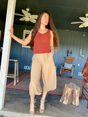 Woman Wearing sustainable tan brown silk culottes ankle pants with wide leg