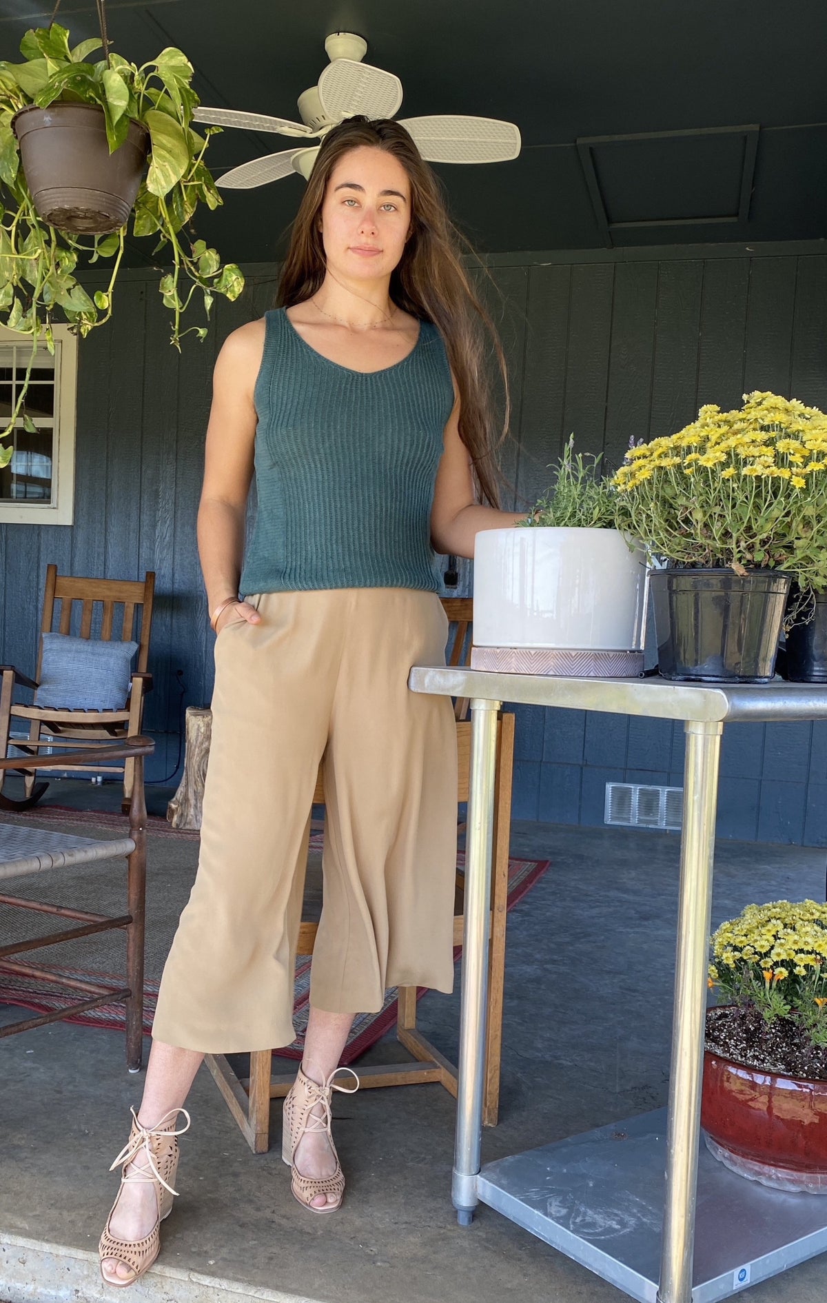 Woman Wearing sustainable tan brown silk culottes ankle pants with wide leg